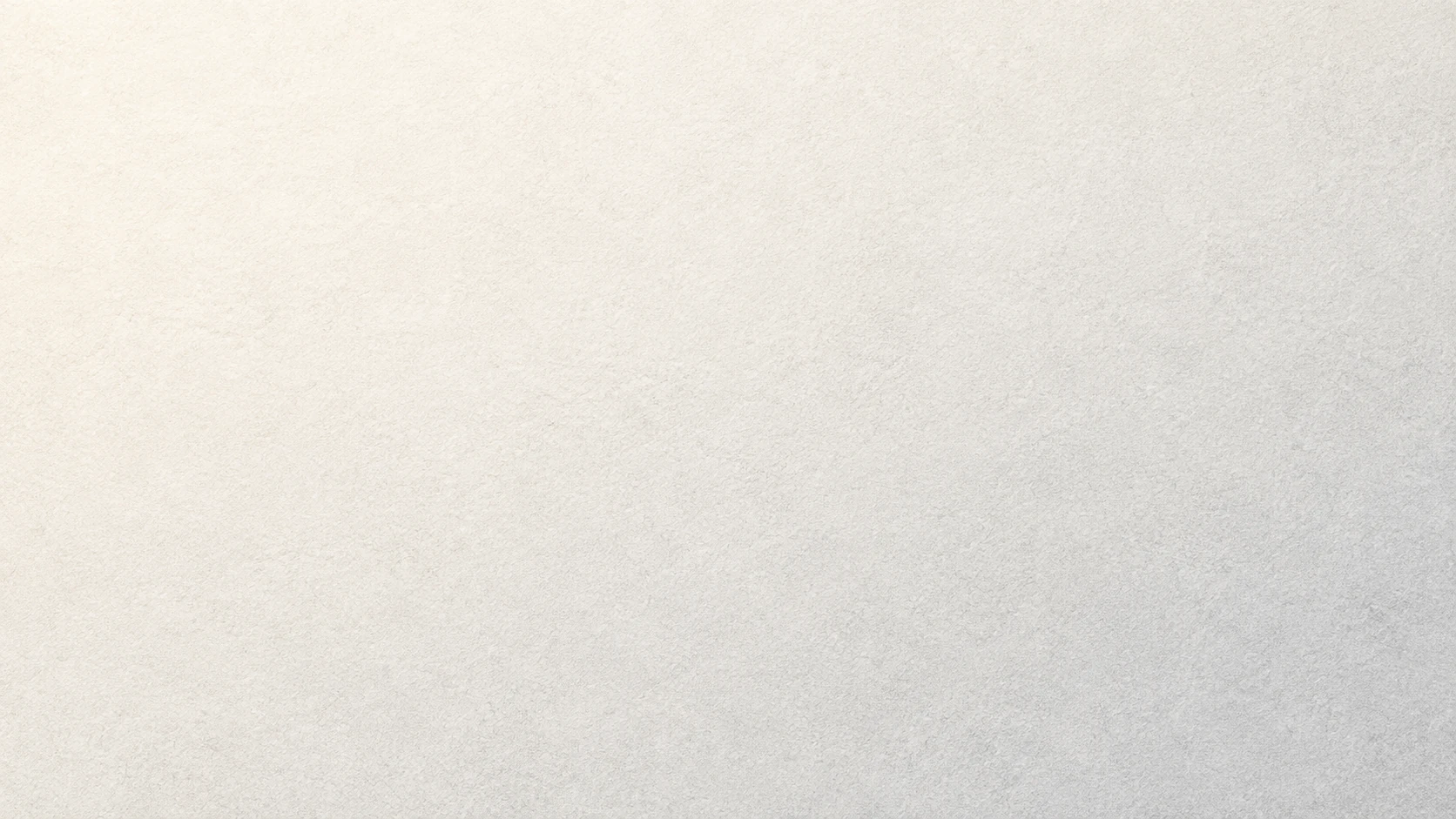 Fine warm-gray grain with a chalk-white light gradient.
